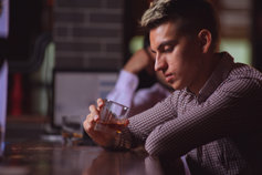 Man drinking at a bar