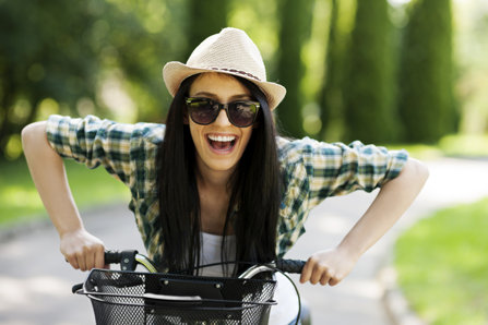 Happy woman on a bicycle