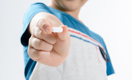Kid holds xanax pill